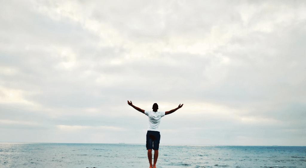 Photo by <a href="https://unsplash.com/@bensghir23?utm_content=creditCopyText&utm_medium=referral&utm_source=unsplash">Said Bensghir</a> on <a href="https://unsplash.com/photos/man-raising-hands-standing-near-seashore-during-daytime-TjtzImYMmJs?utm_content=creditCopyText&utm_medium=referral&utm_source=unsplash">Unsplash</a>