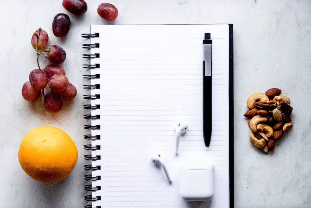 Photo by <a href="https://unsplash.com/@taylorheeryphoto?utm_content=creditCopyText&utm_medium=referral&utm_source=unsplash">Taylor Heery</a> on <a href="https://unsplash.com/photos/a-notepad-pen-fruit-and-a-charger-on-a-table-LKRze0JbwhQ?utm_content=creditCopyText&utm_medium=referral&utm_source=unsplash">Unsplash</a>